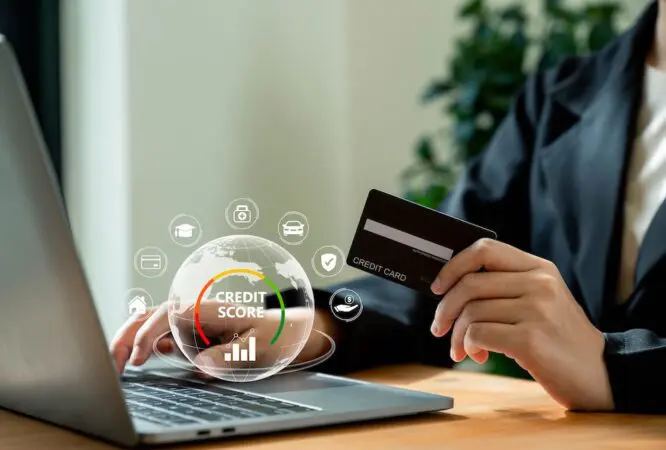 Credit score concept, Businesswoman using laptop with credit score for student loan, mortgage and payment cards.
