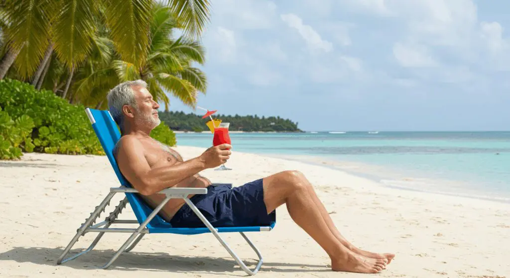 a retired man enjoying beach because he learned about money