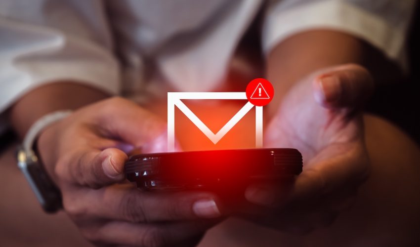 Sms,Spam,And,Fake,Text,Message,Phishing,From,Scammer,Concept. SMS spam and fake text message phishing from scammer concept. System hacked warning alert, email hack, scam malware spreading virus on message alert virtual on mobile phone screen in woman's hands.